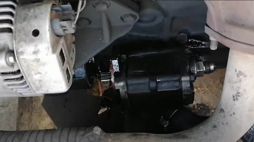 Uncoupling a damaged Toyota forklift hydraulic pump for maintenance or replacement